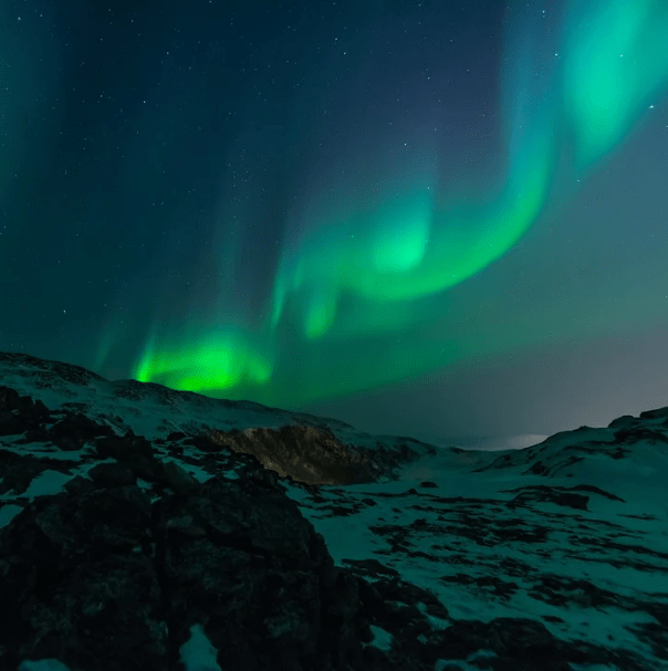 snowy mountain, night sky, stars, northern lights