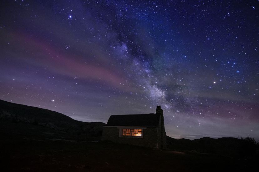 night sky, house, lights, stars, galaxy, rock formations