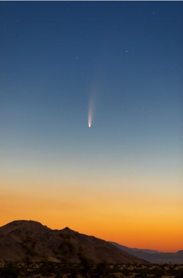 a-comet-on-a-blue-sky-and-a-mountain-and-a-field