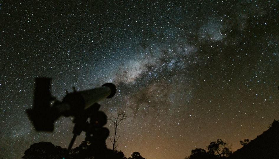 A telescope under the night sky