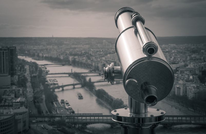 a telescope overlooking a city