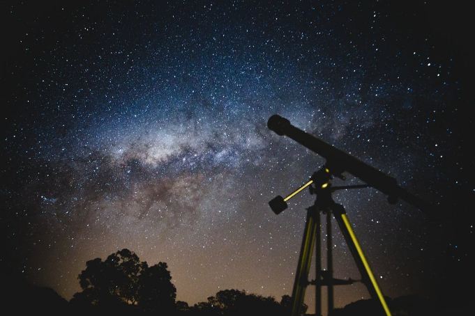 telescope under a starry sky
