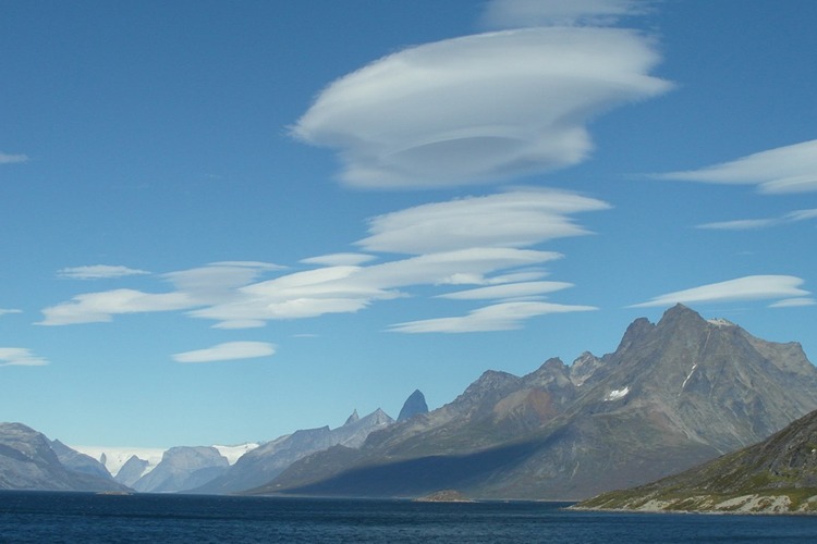 lens-shaped clouds, blue sea, tall mountains
