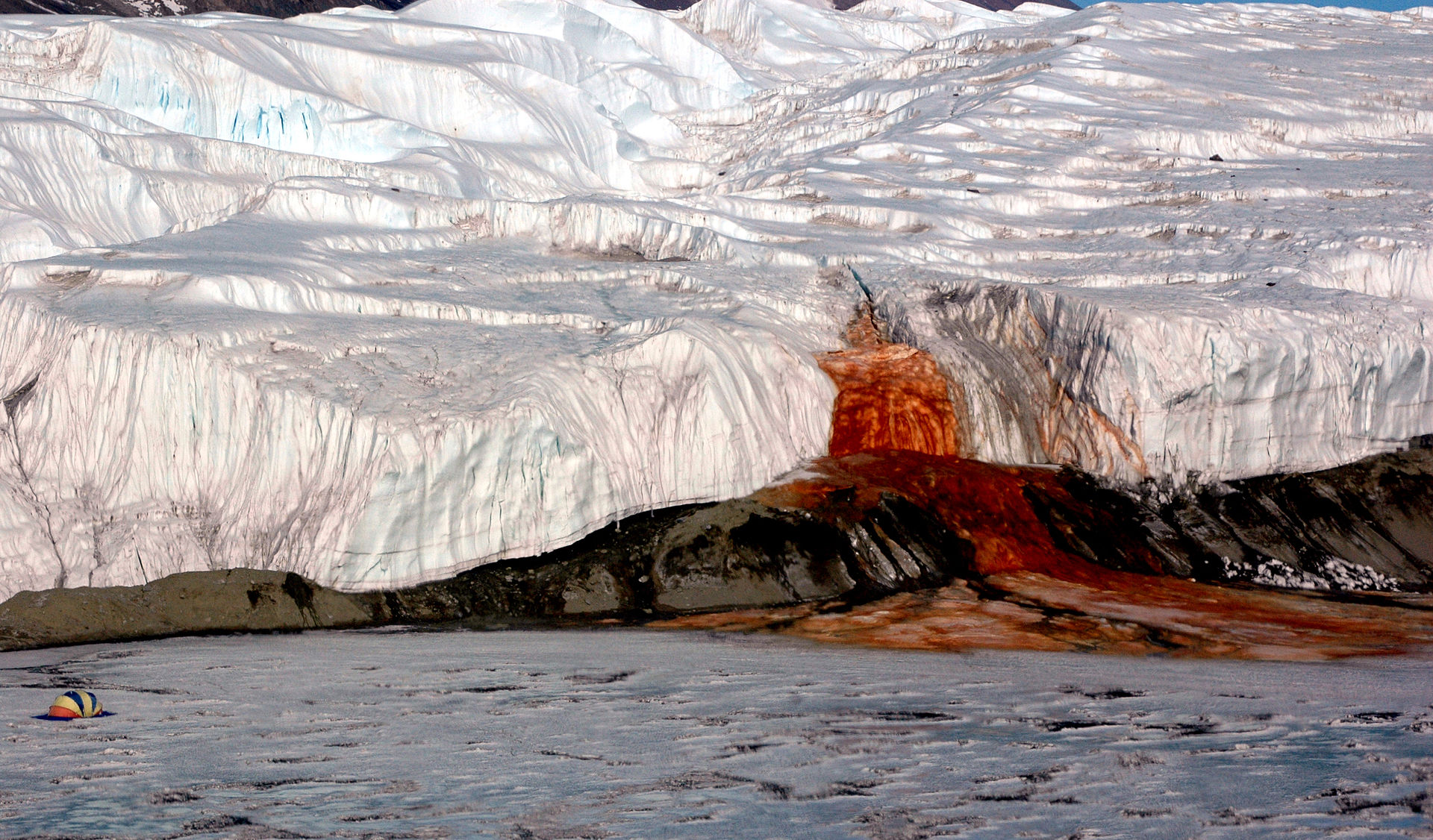 a red fall from an icy cliff