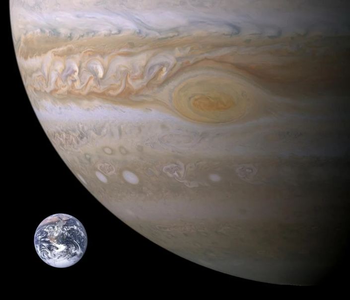 How the tiny Earth looks like in front of Jupiter.