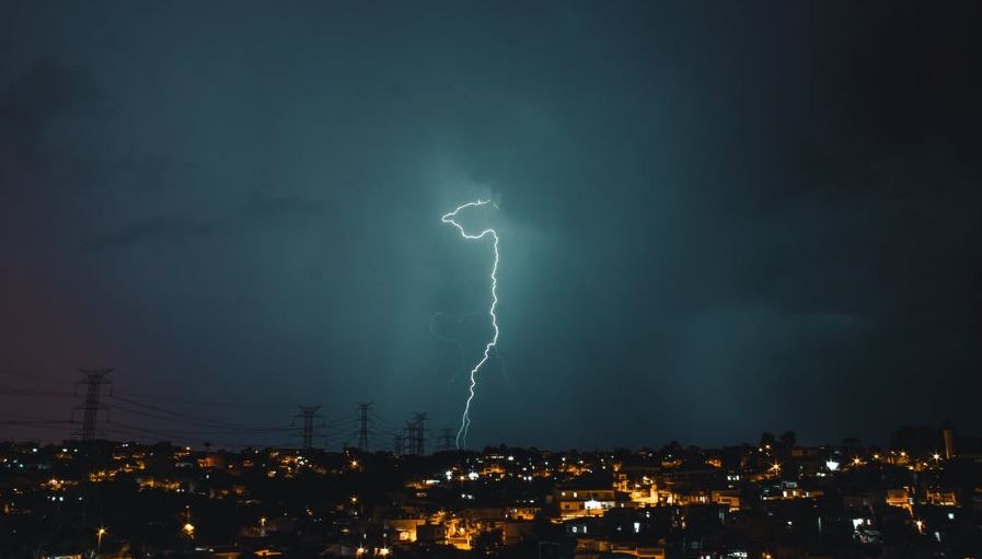 A lightning striking a utility post